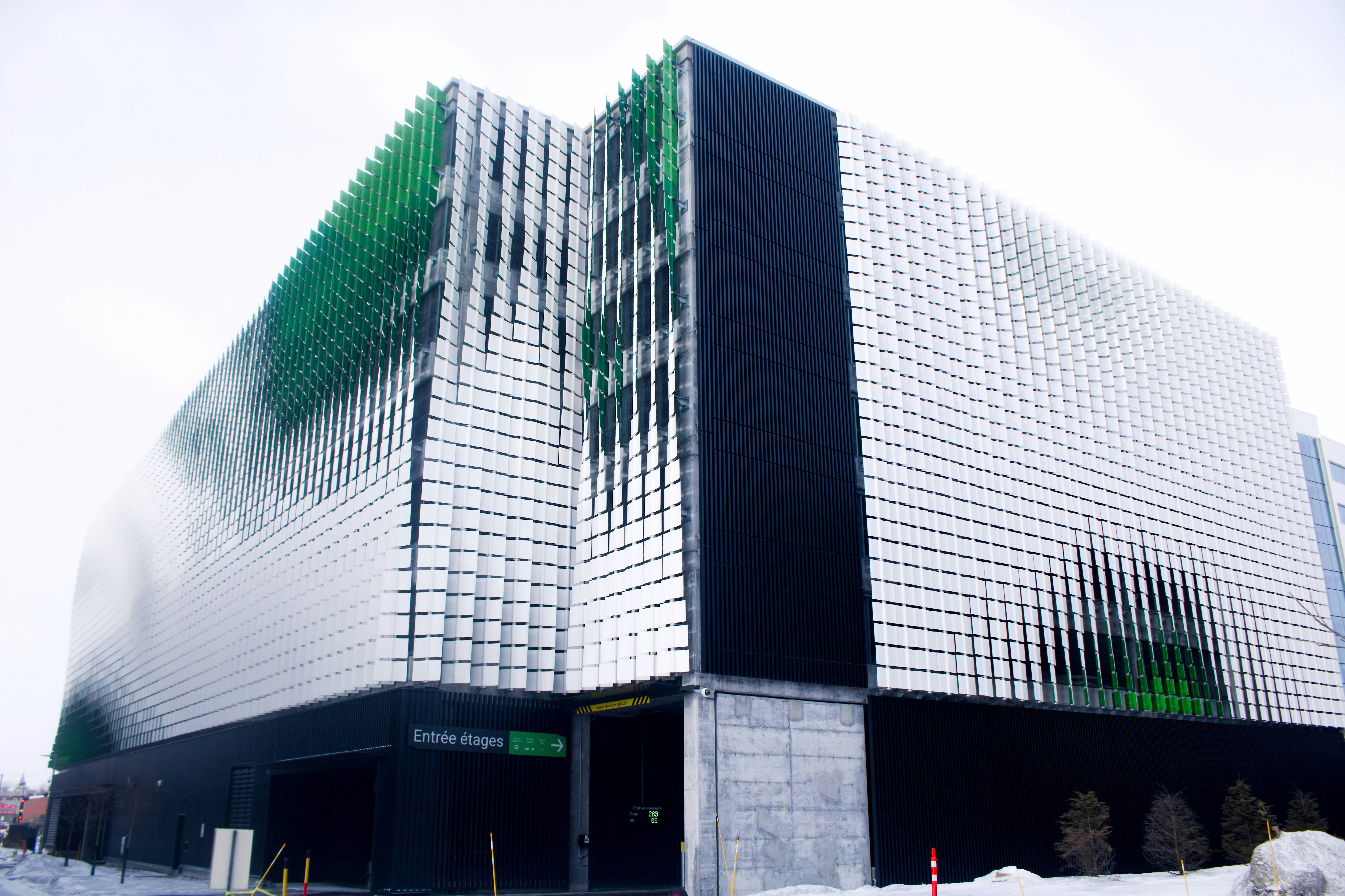 A large building with a lot of windows on it photo – Free Québec Image ...
