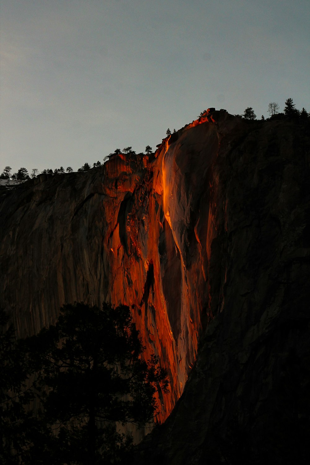 a very tall mountain with a very bright light on it