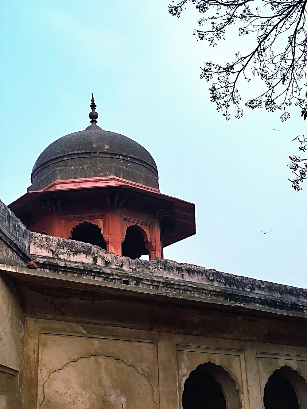 an old building with a dome on top of it