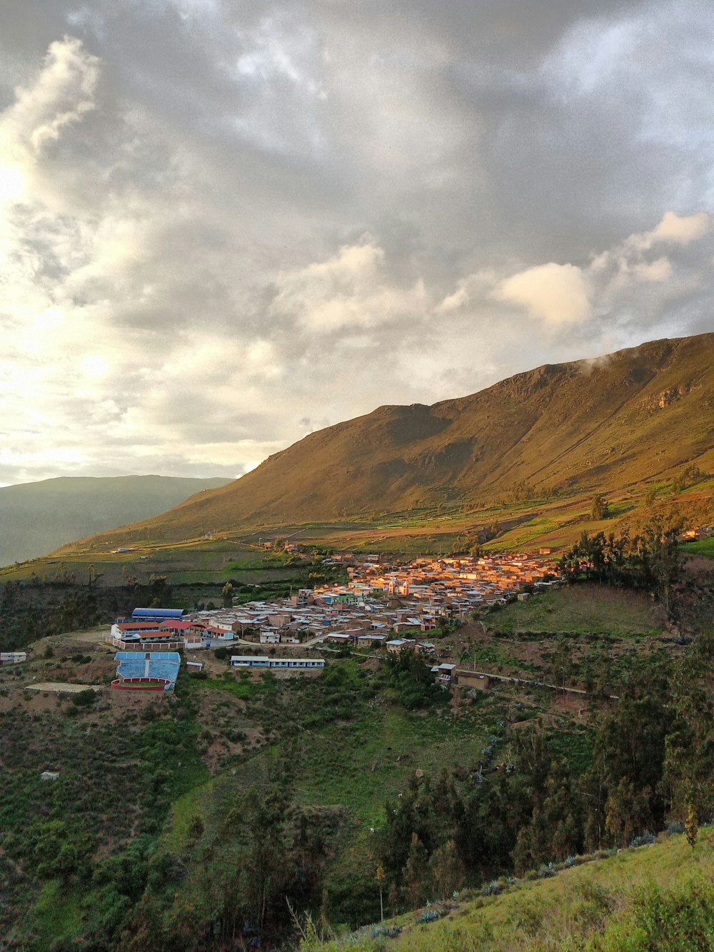 a view of a small village in the mountains