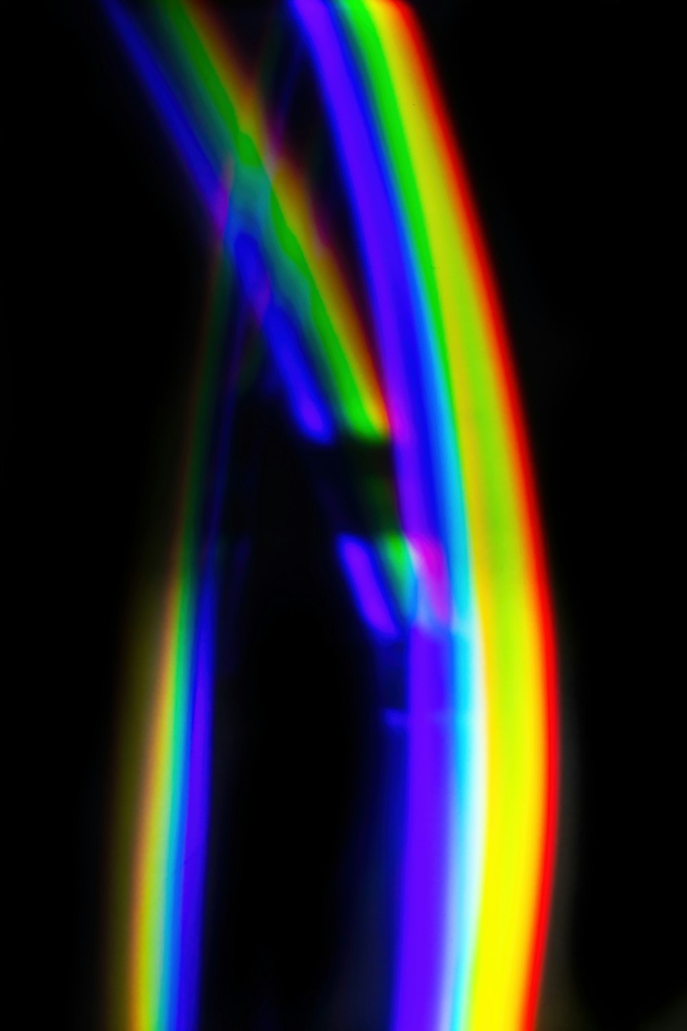a blurry photo of a rainbow colored object