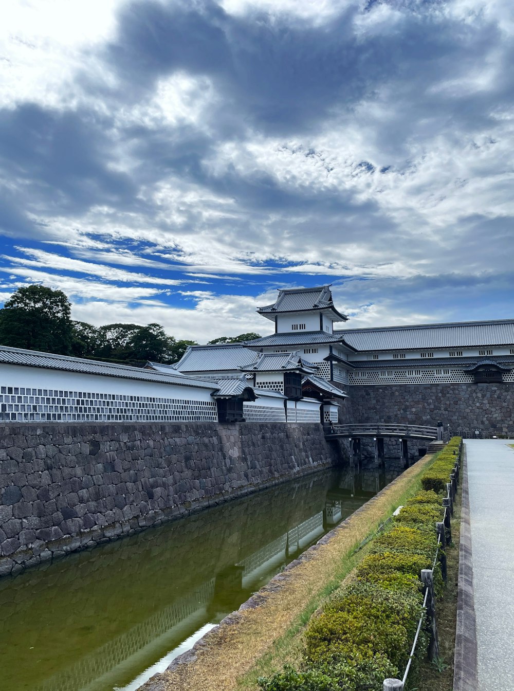 a large building sitting on the side of a river