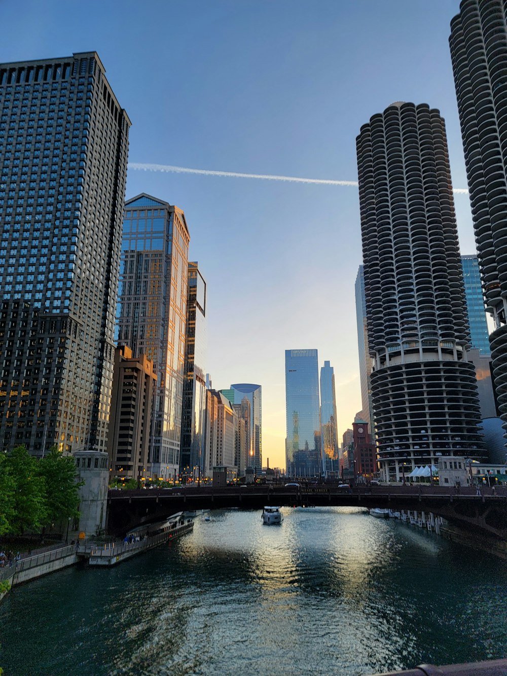 a river running through a city next to tall buildings