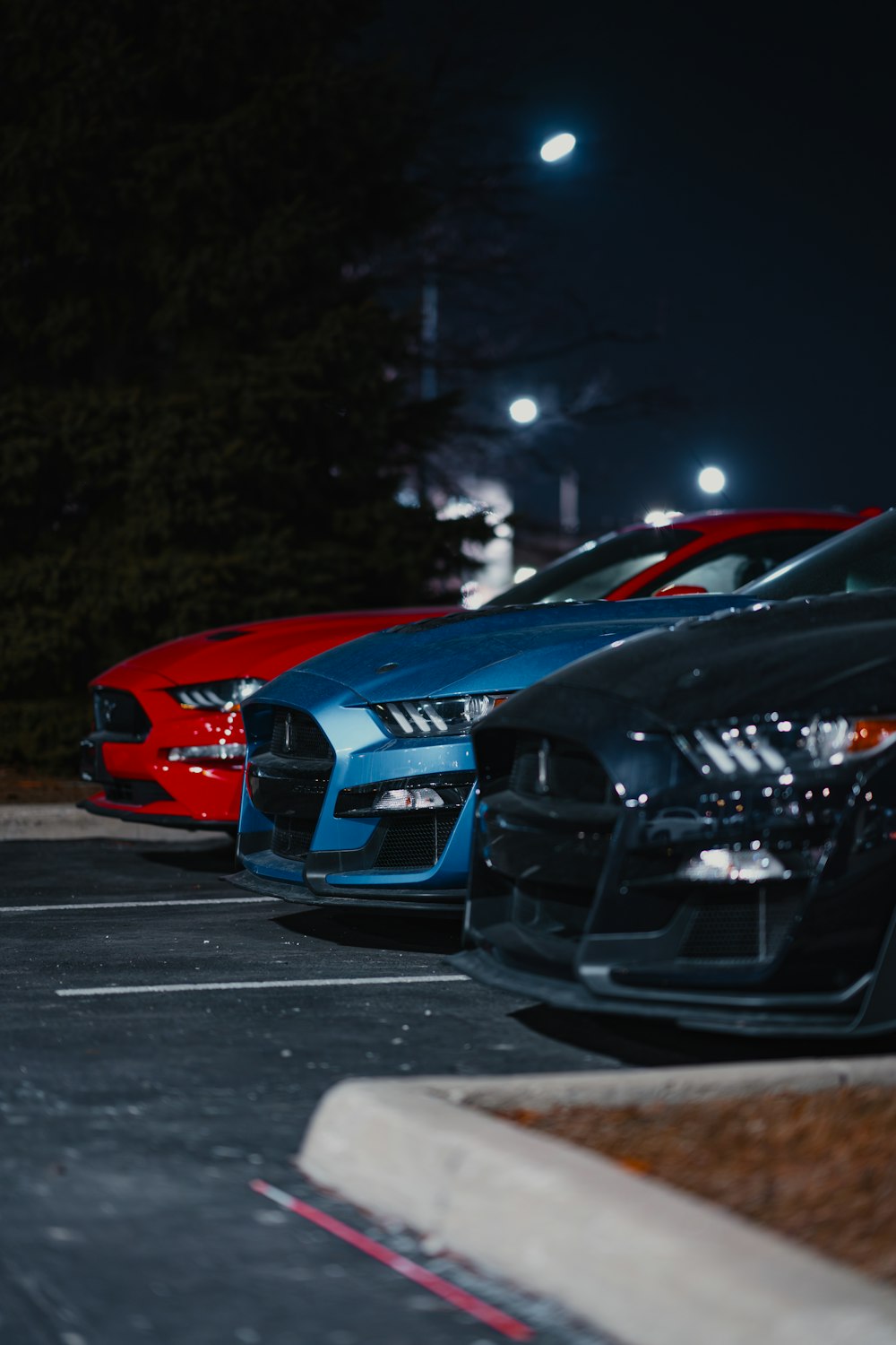 a row of cars parked in a parking lot