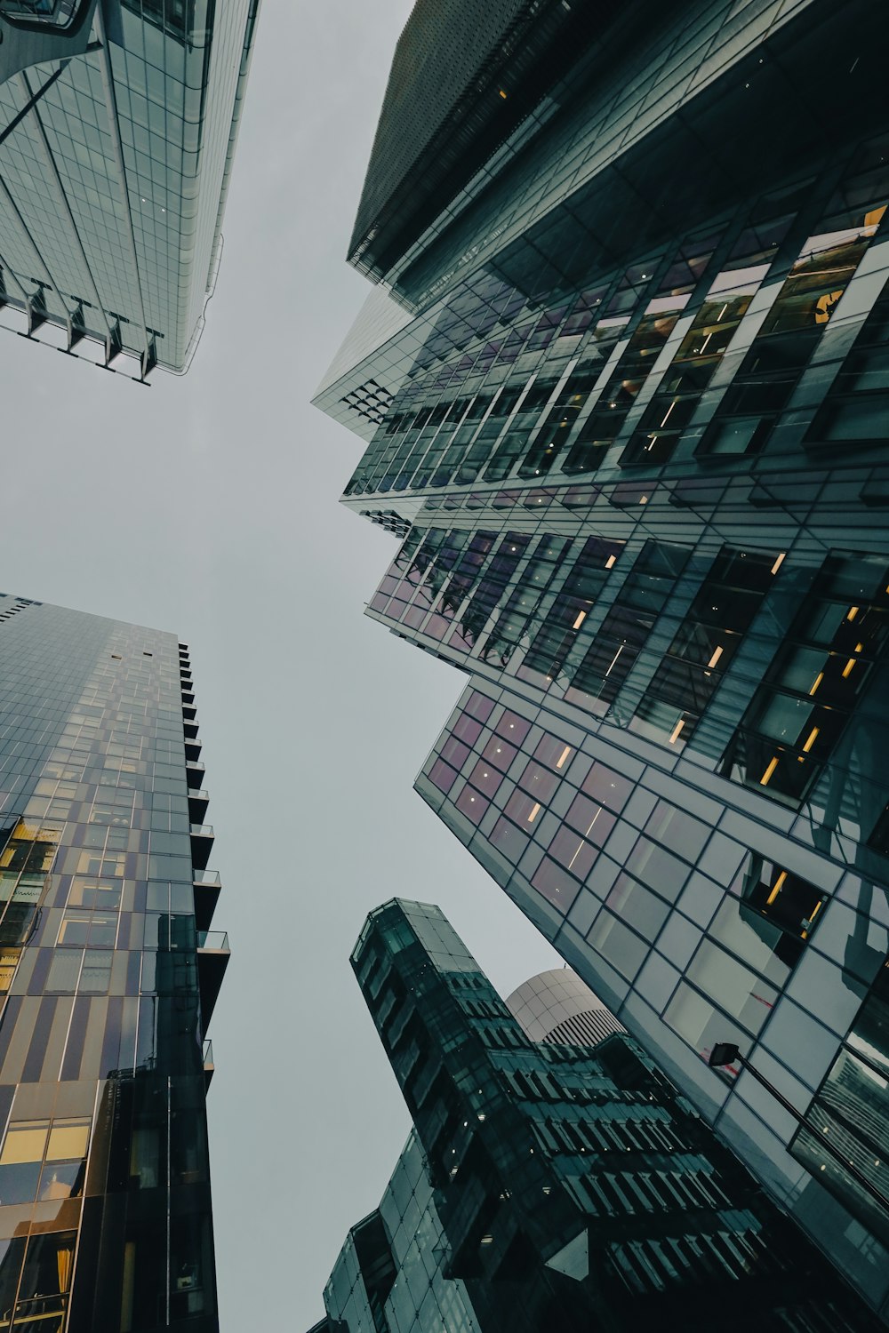 looking up at tall buildings in a city