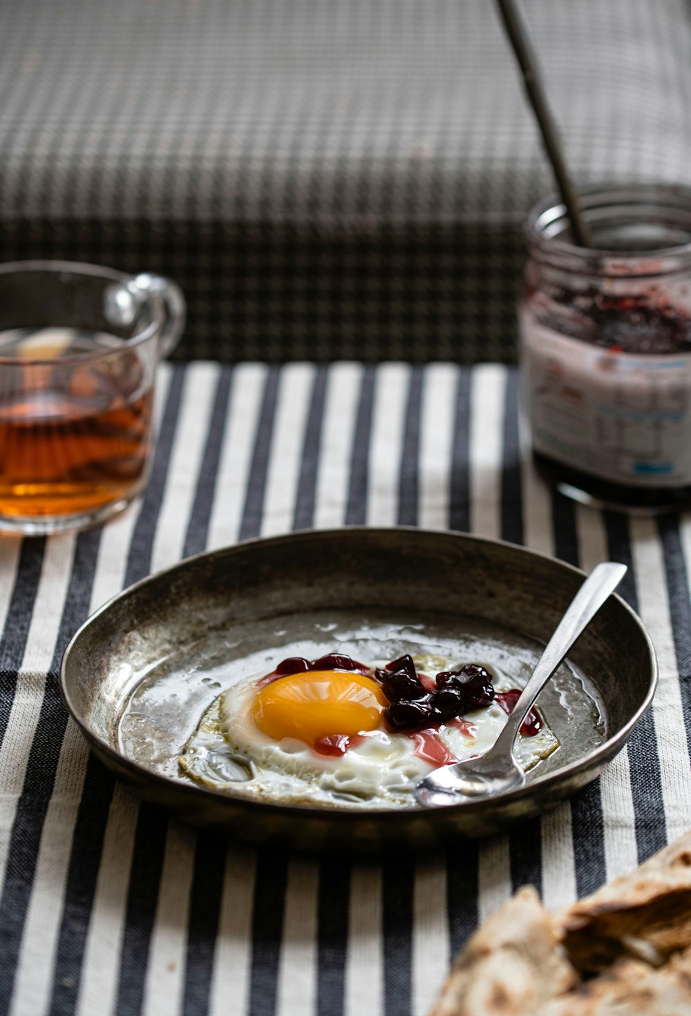 a bowl of food on a table with a spoon