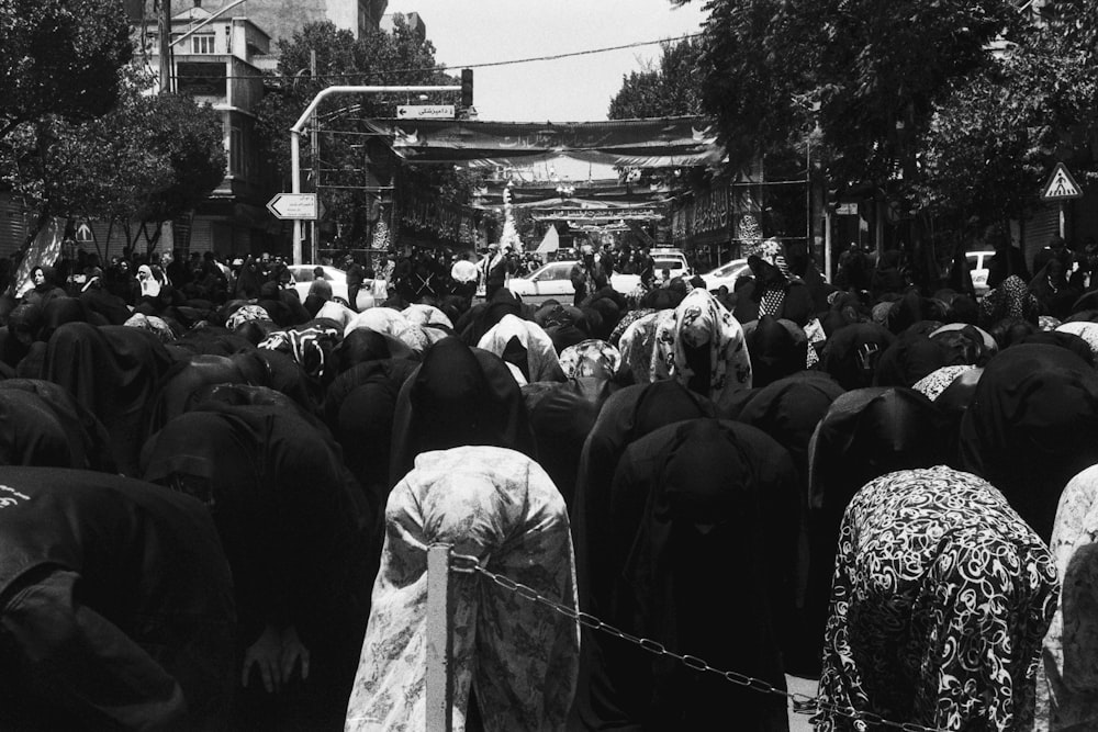 a large group of people standing around each other