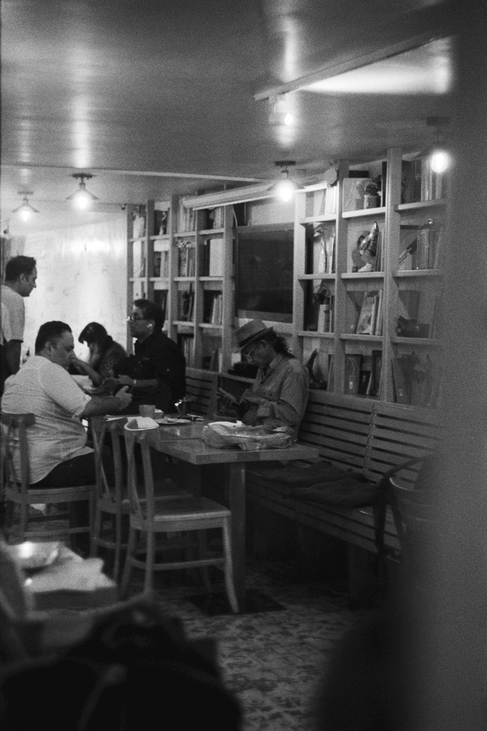 a group of people sitting at a table in a room