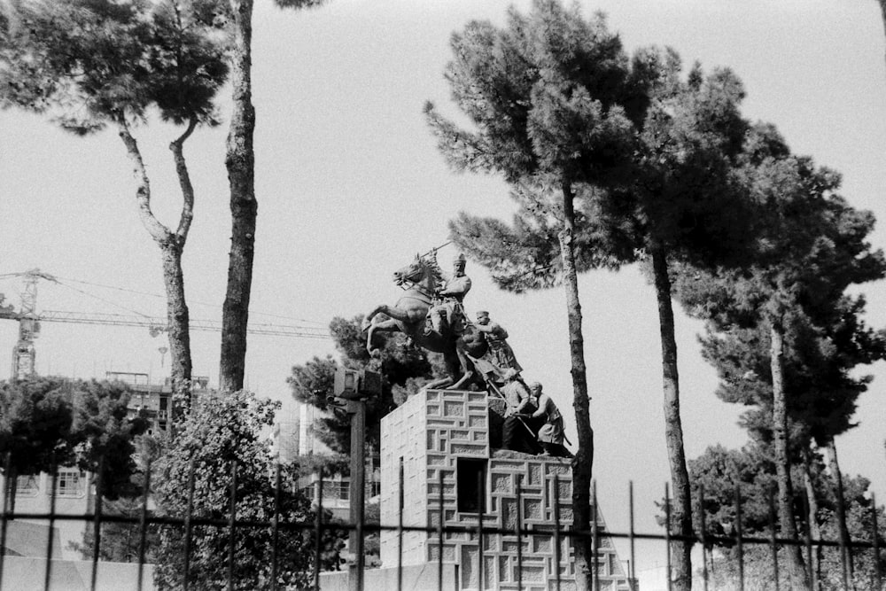 a black and white photo of a clock tower