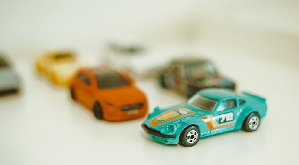 a group of toy cars sitting on top of a table