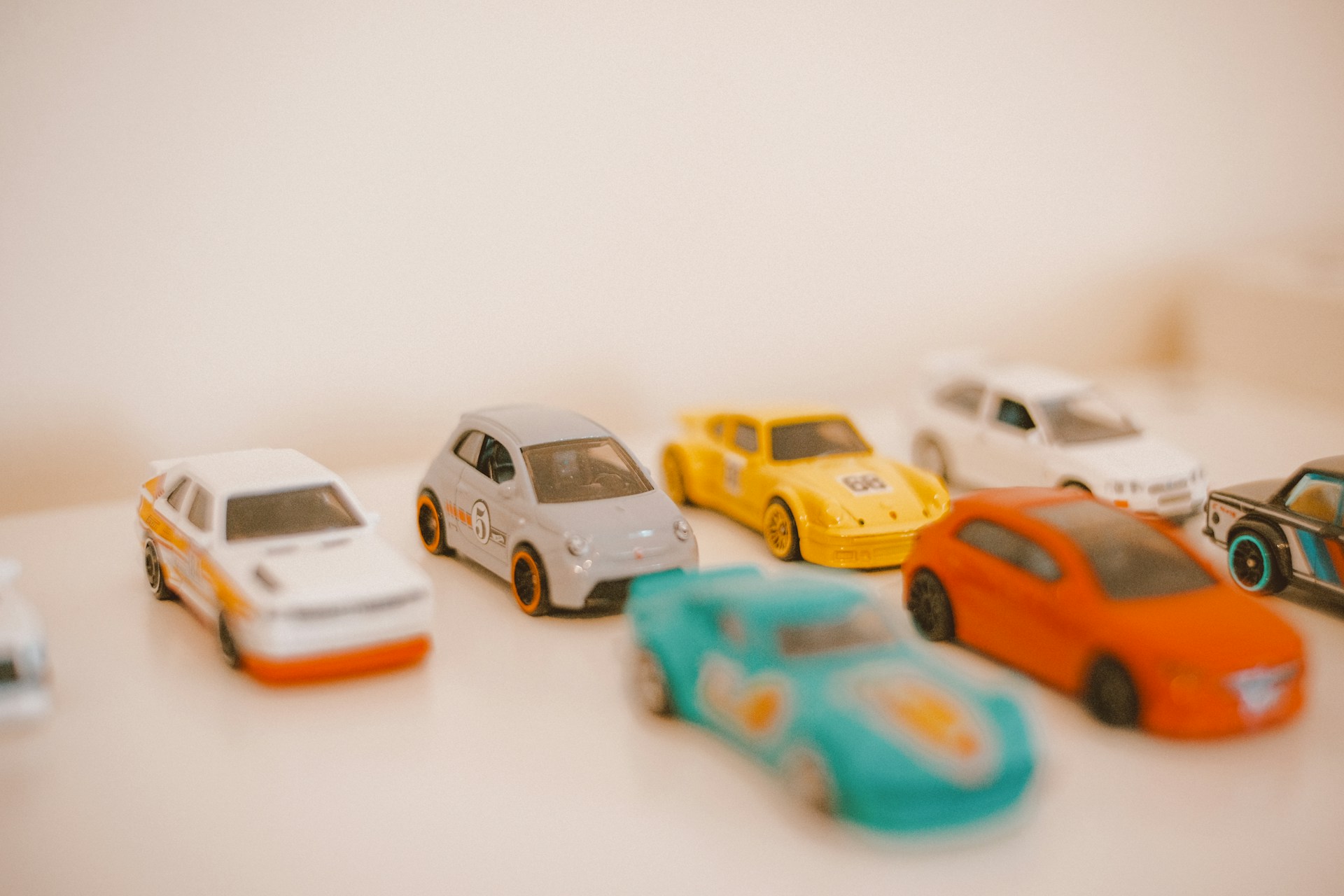 a group of toy cars sitting on top of a table