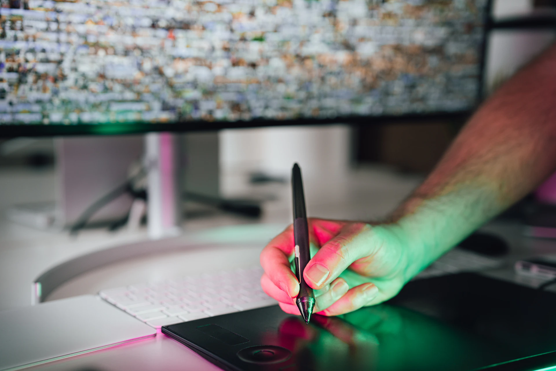 a person writing on a piece of paper with a pen