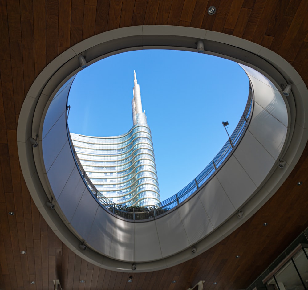 a view of a building through a circular window