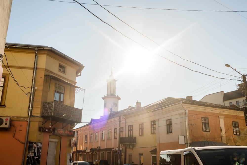 the sun shines brightly on a city street