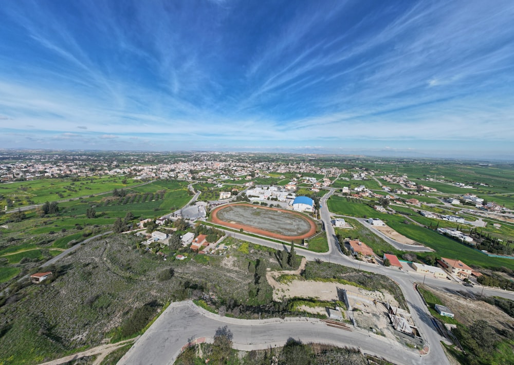 a bird's eye view of a parking lot in a rural area