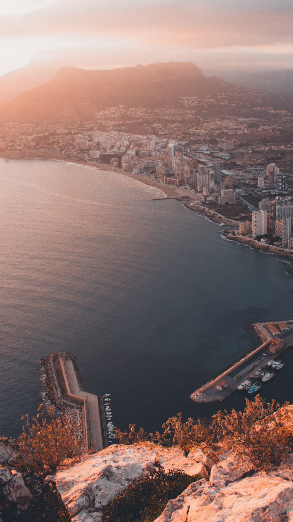 a large body of water with a city in the background