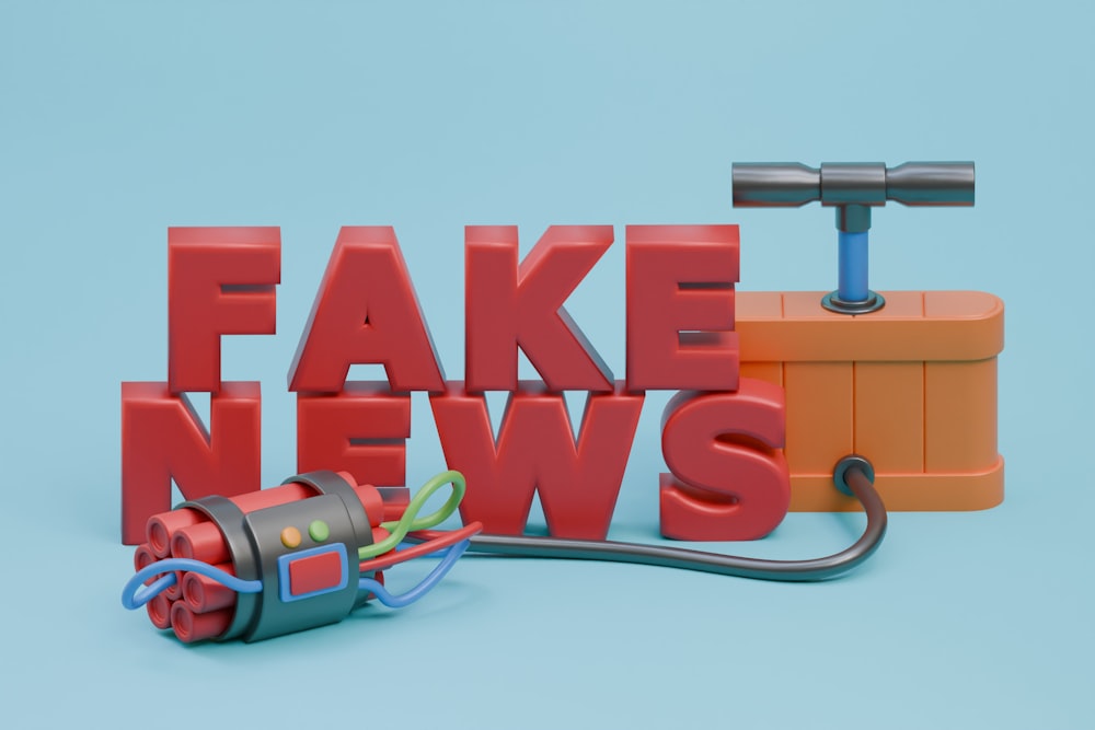a fake news sign with a hammer and a tool
