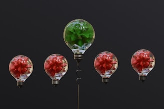 a group of light bulbs with flowers in them