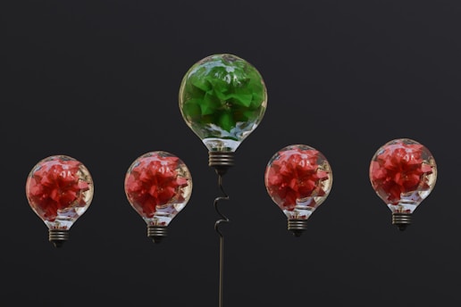 a group of light bulbs with flowers in them