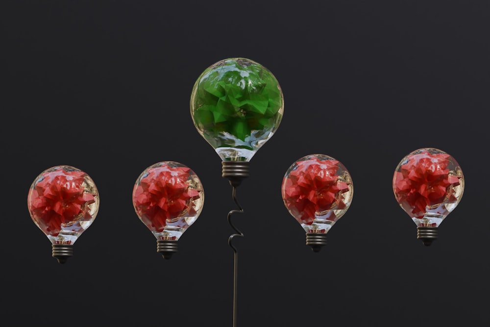 a group of light bulbs with flowers in them