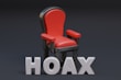 a red chair sitting next to the word hoax