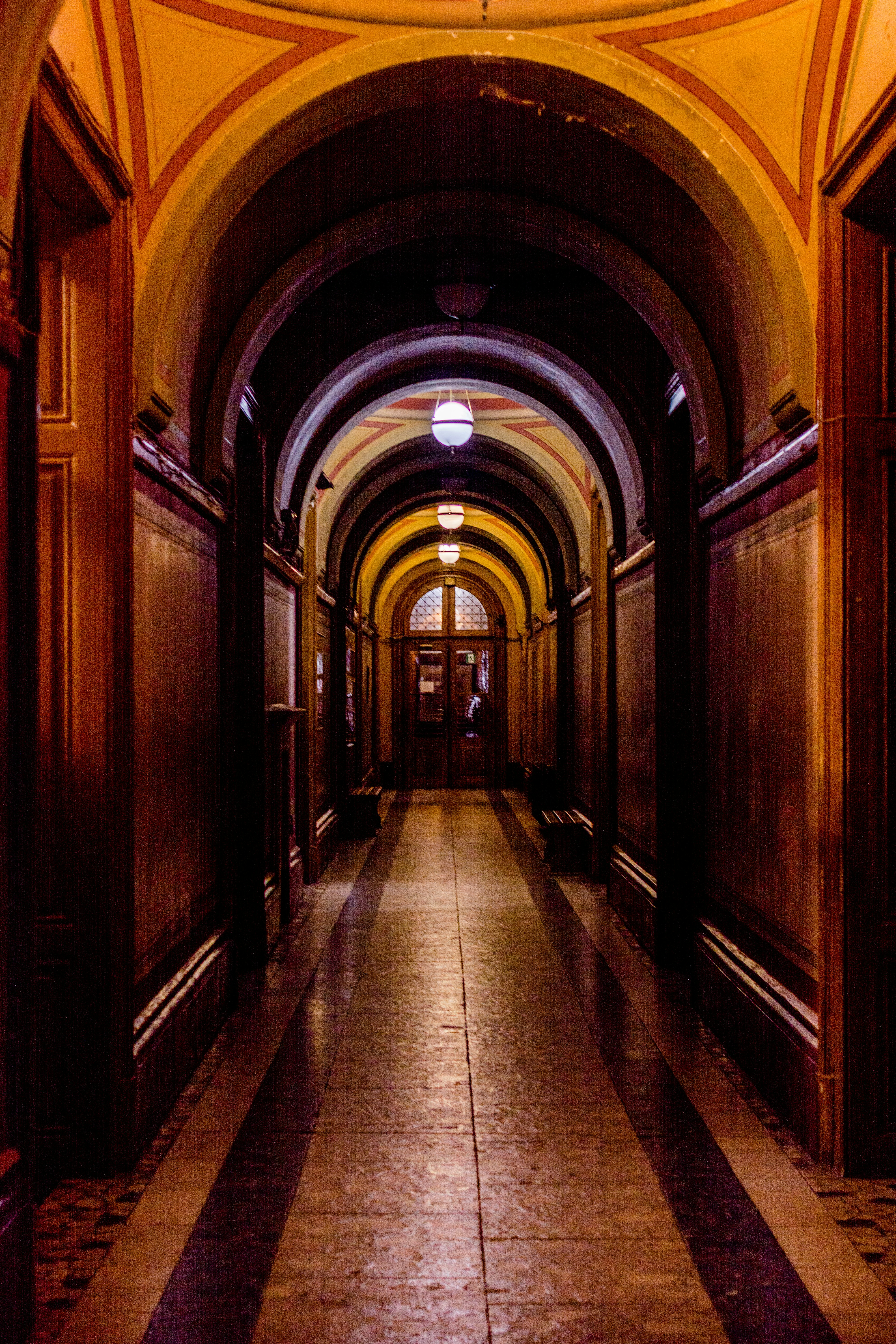 a long hallway with a clock on the wall