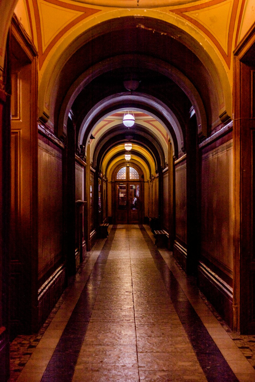 a long hallway with a clock on the wall