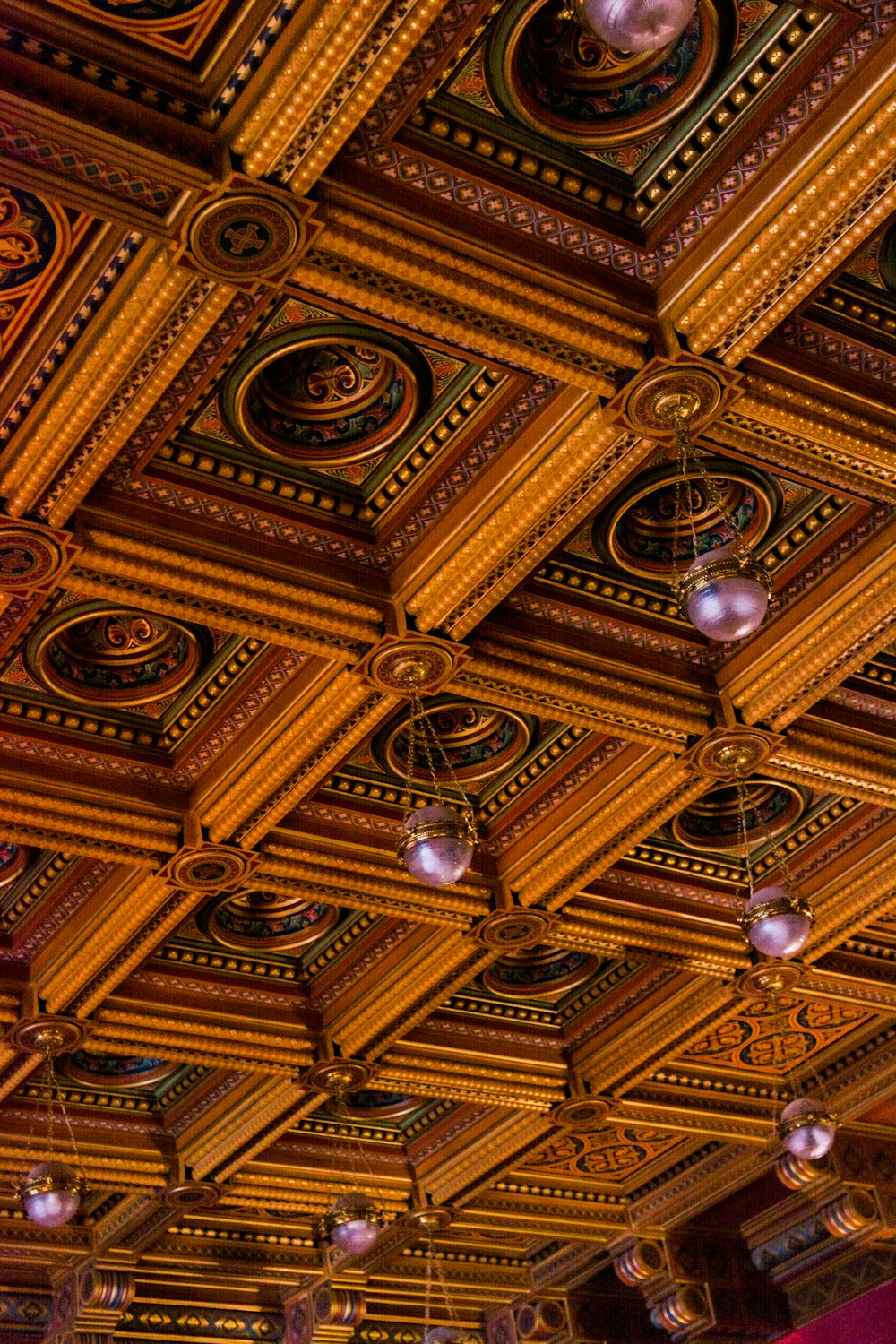 the ceiling of a restaurant with many lights