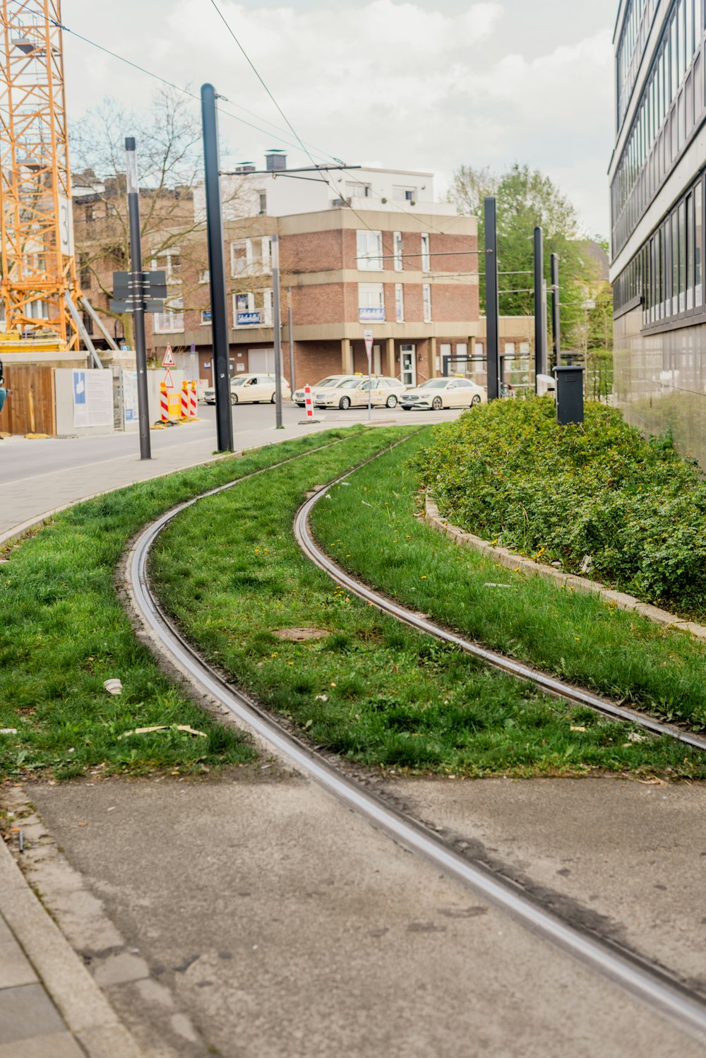 a couple of tracks that are next to a building