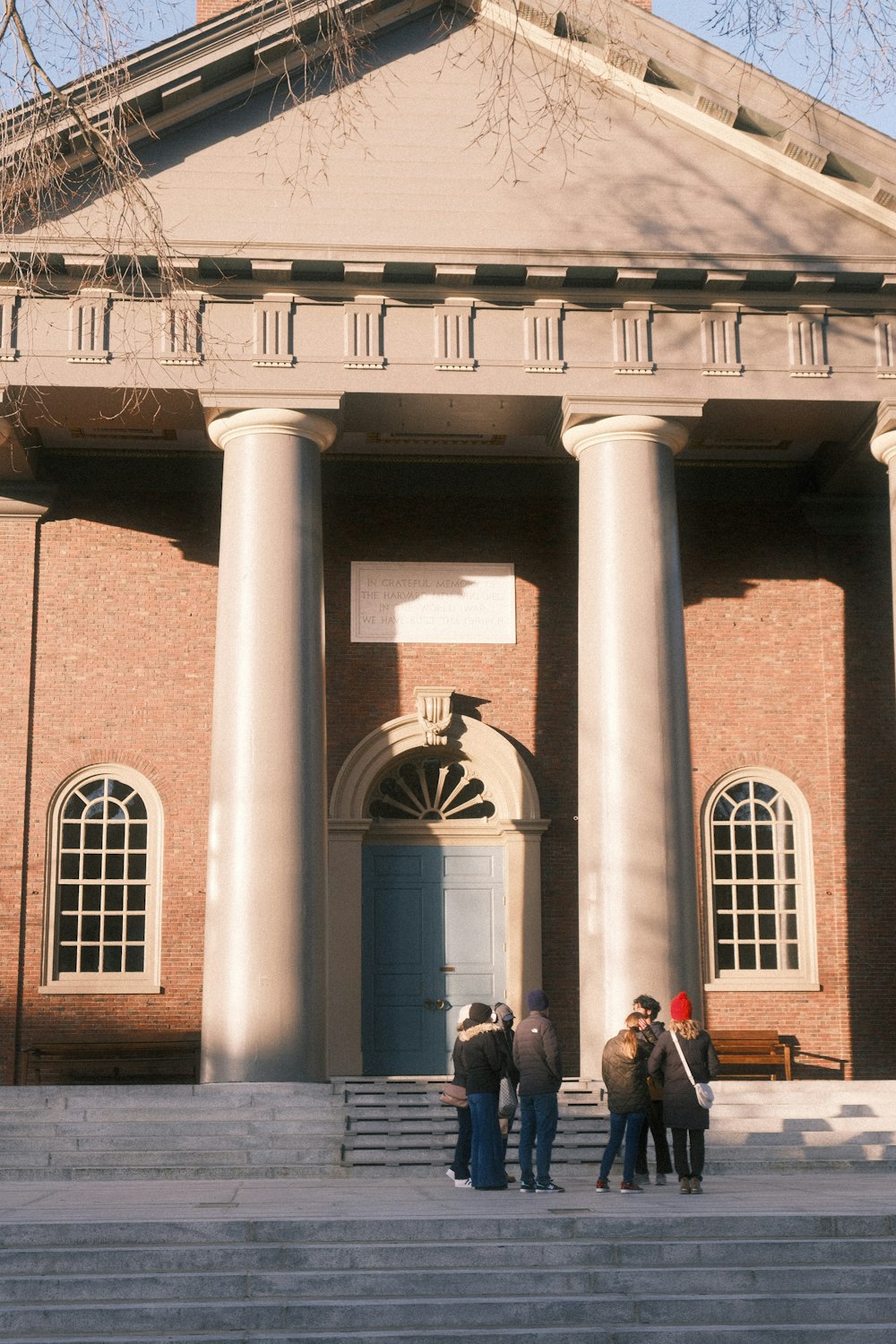 a group of people standing in front of a building