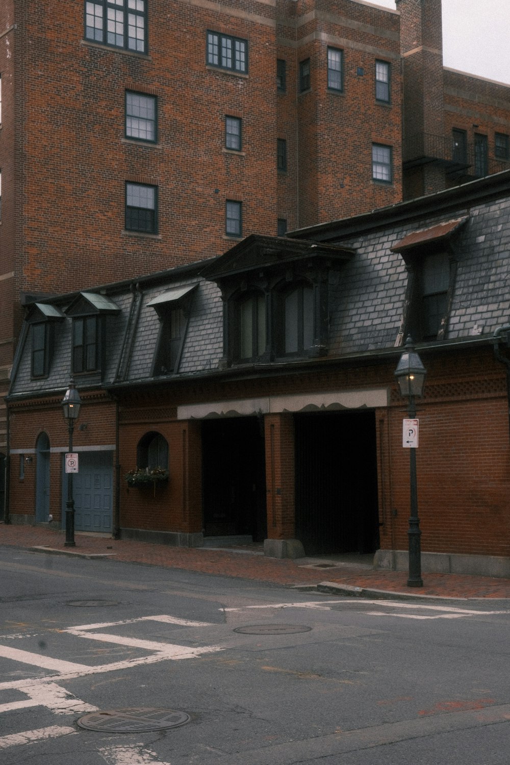 an old brick building with a clock on the front of it