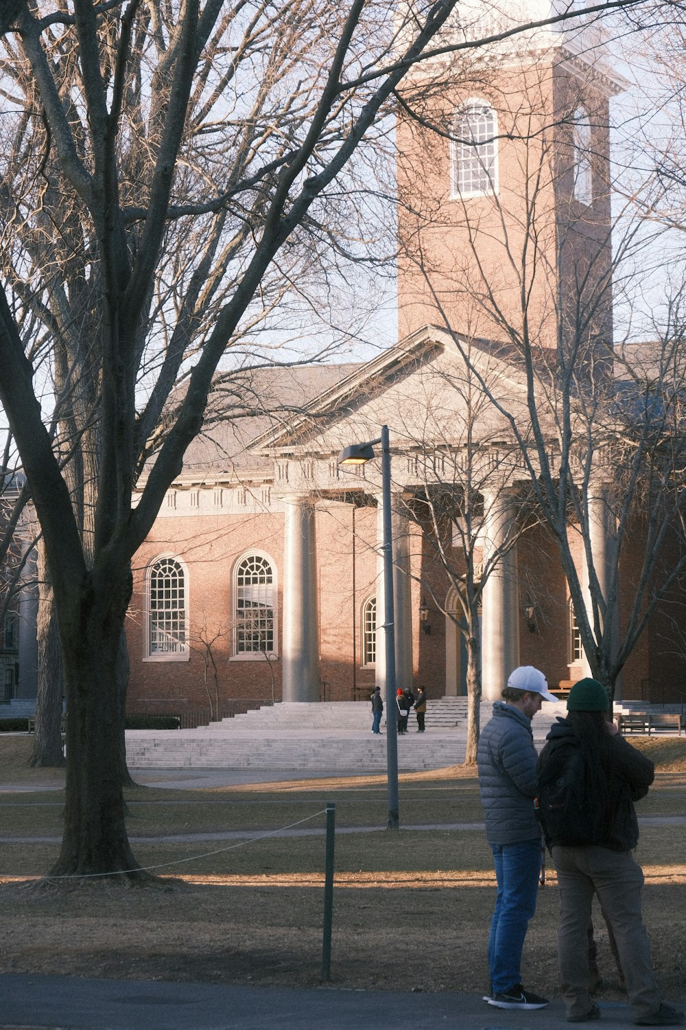 a couple of people standing in front of a building