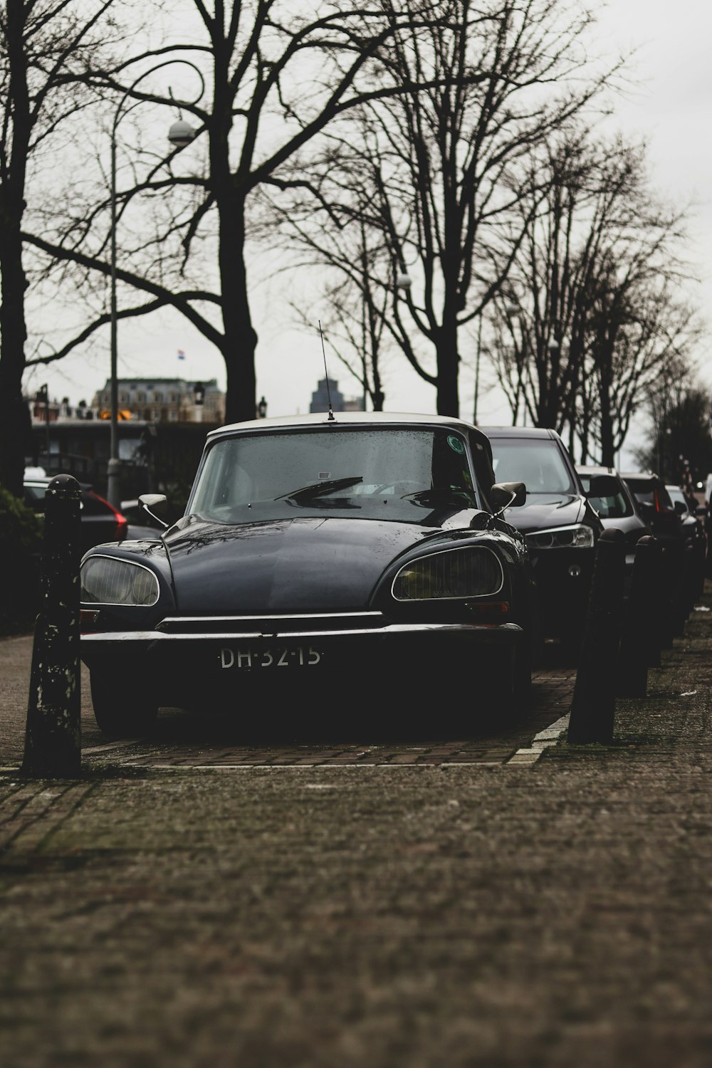 a row of parked cars sitting next to each other