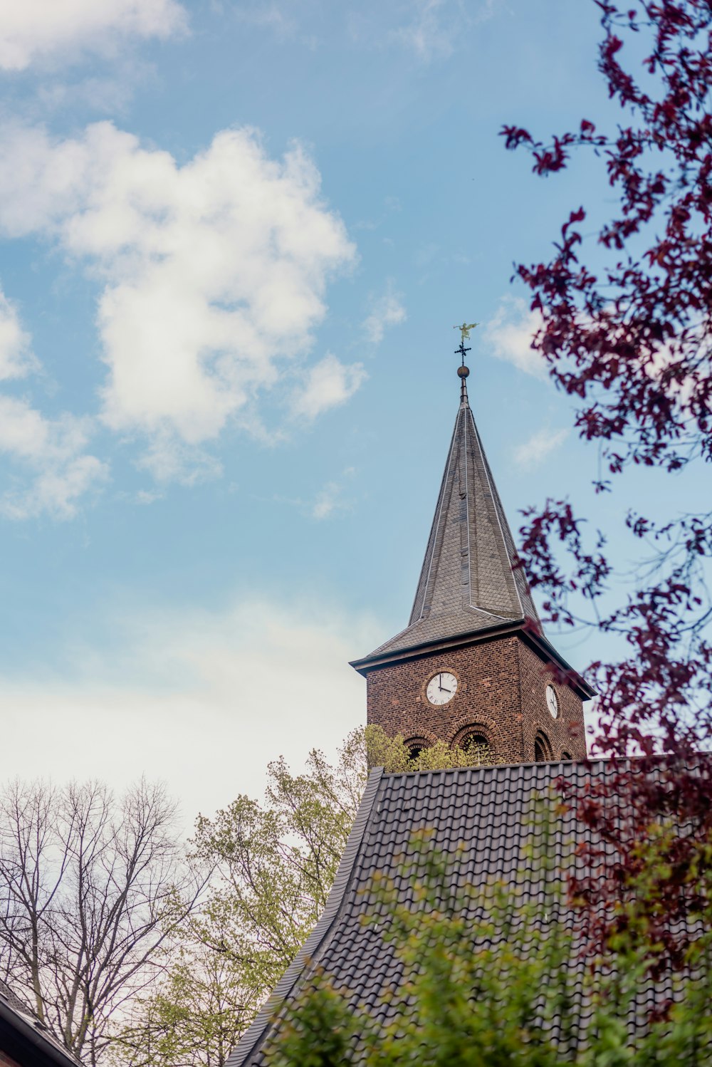 a church steeple with a clock on it