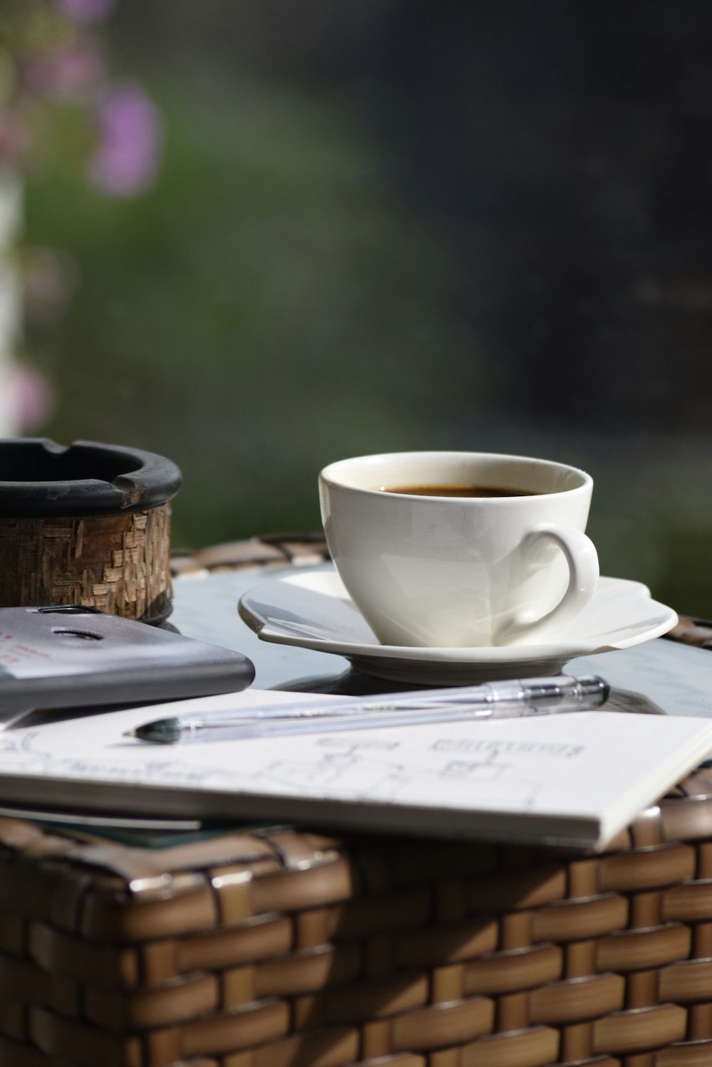 a cup of coffee sitting on top of a table