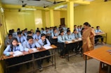 a classroom full of students sitting at desks