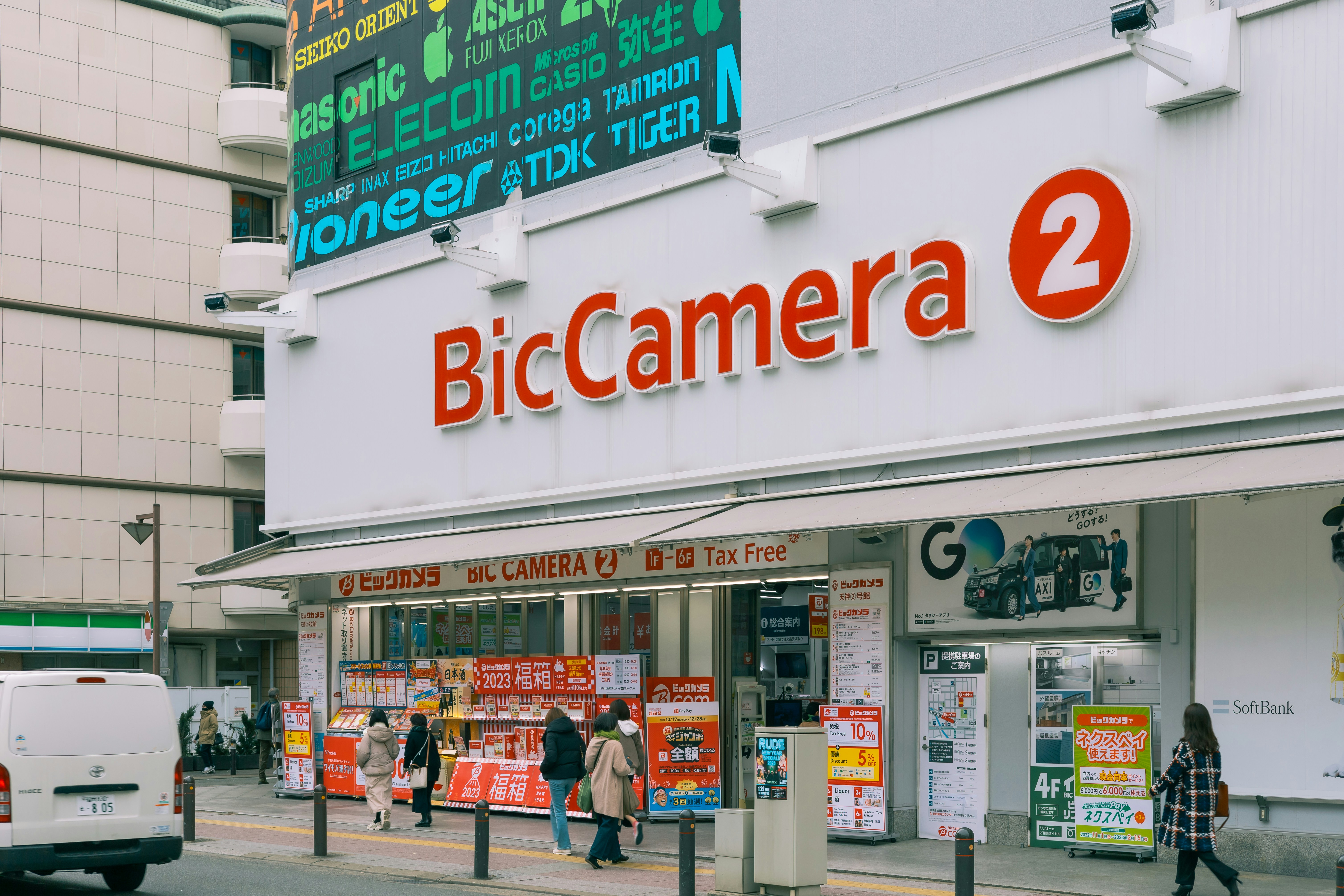 a big camera store on the side of a street