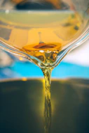 a close up of a liquid being poured into a bowl