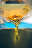 a close up of a liquid being poured into a bowl