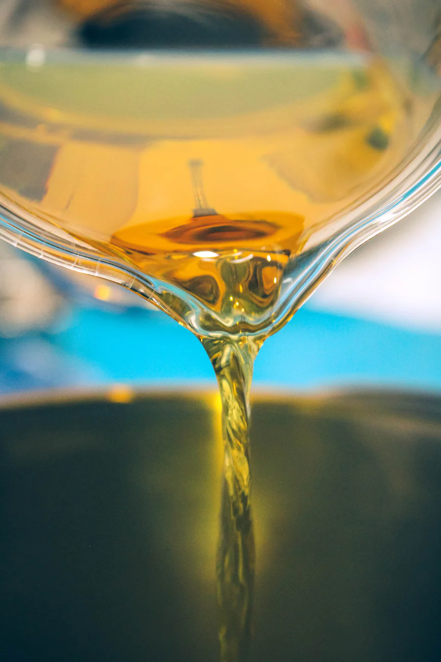 Used oil being poured into a collection container