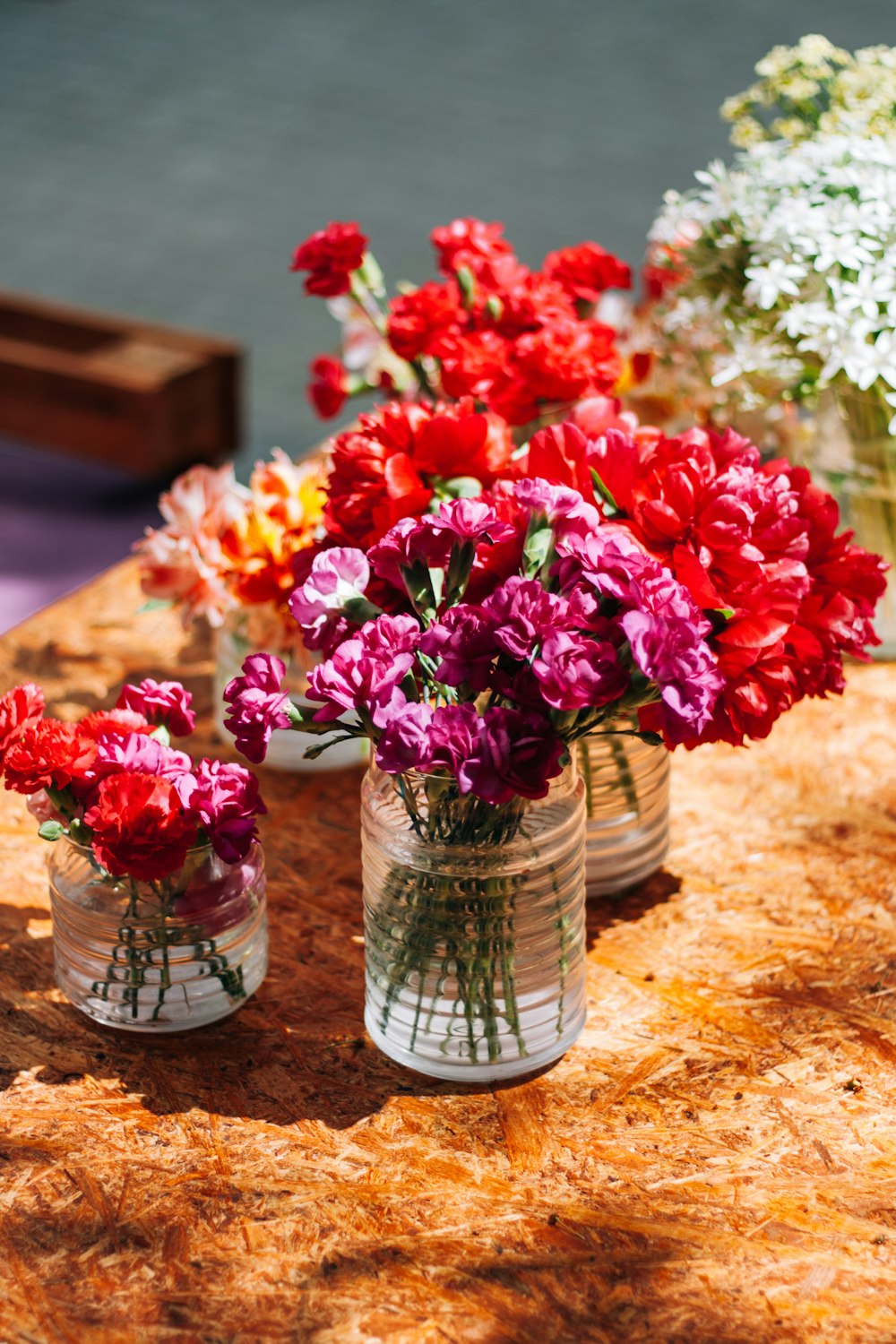 a table topped with vases filled with flowers