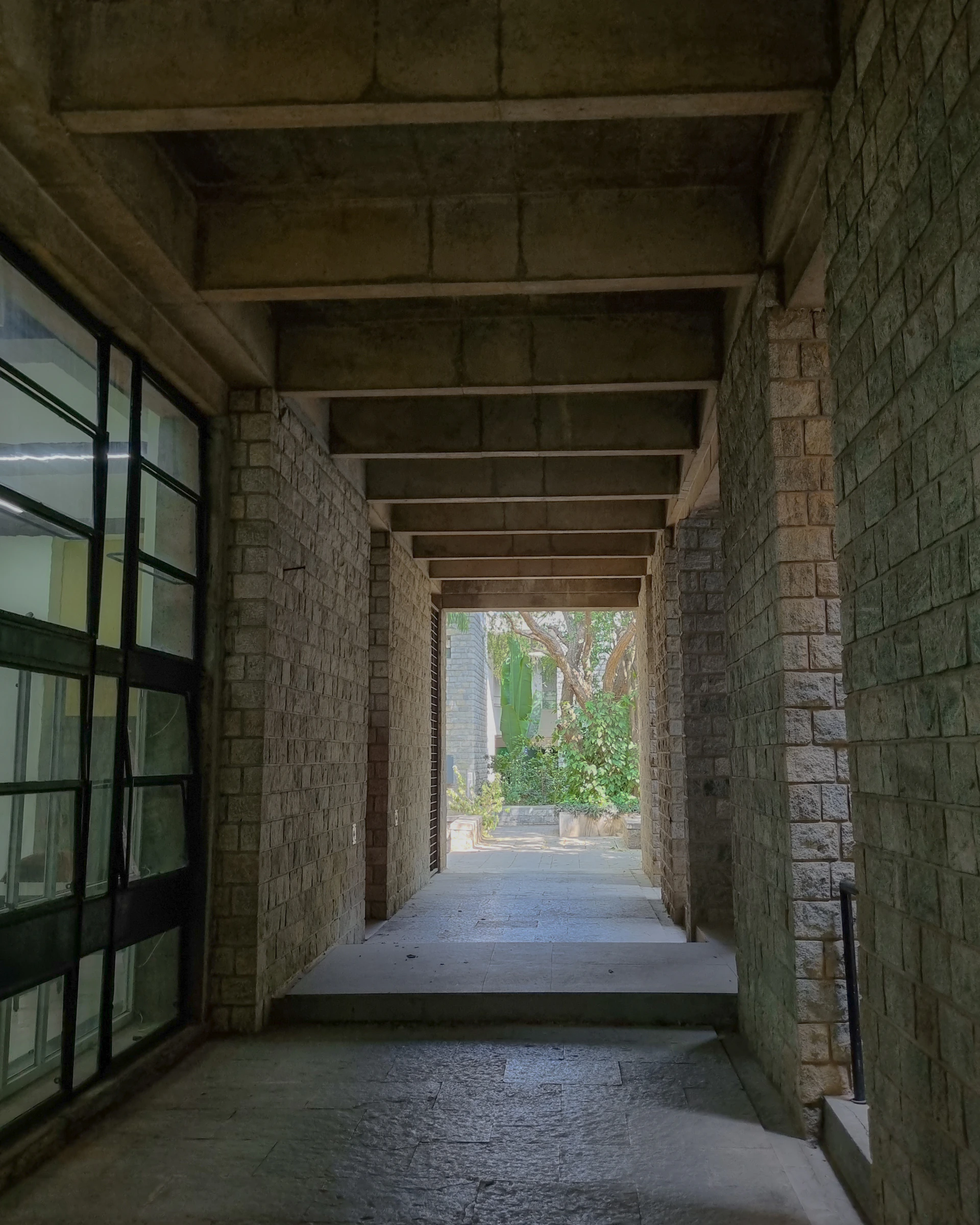 a long hallway with a clock on the wall