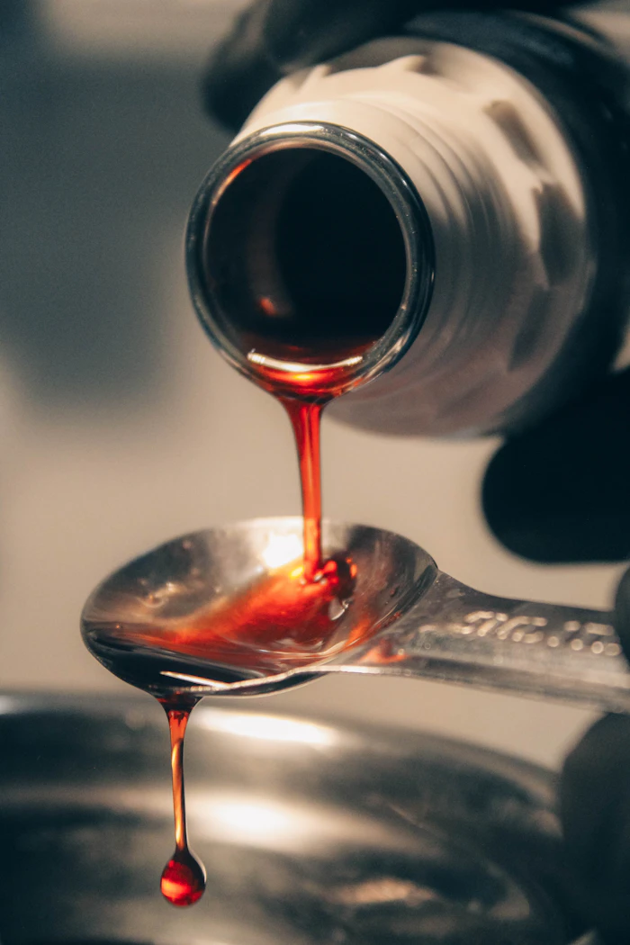 Liquid being poured onto a spoon