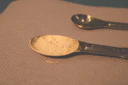 a spoon and a spoon rest on a cloth