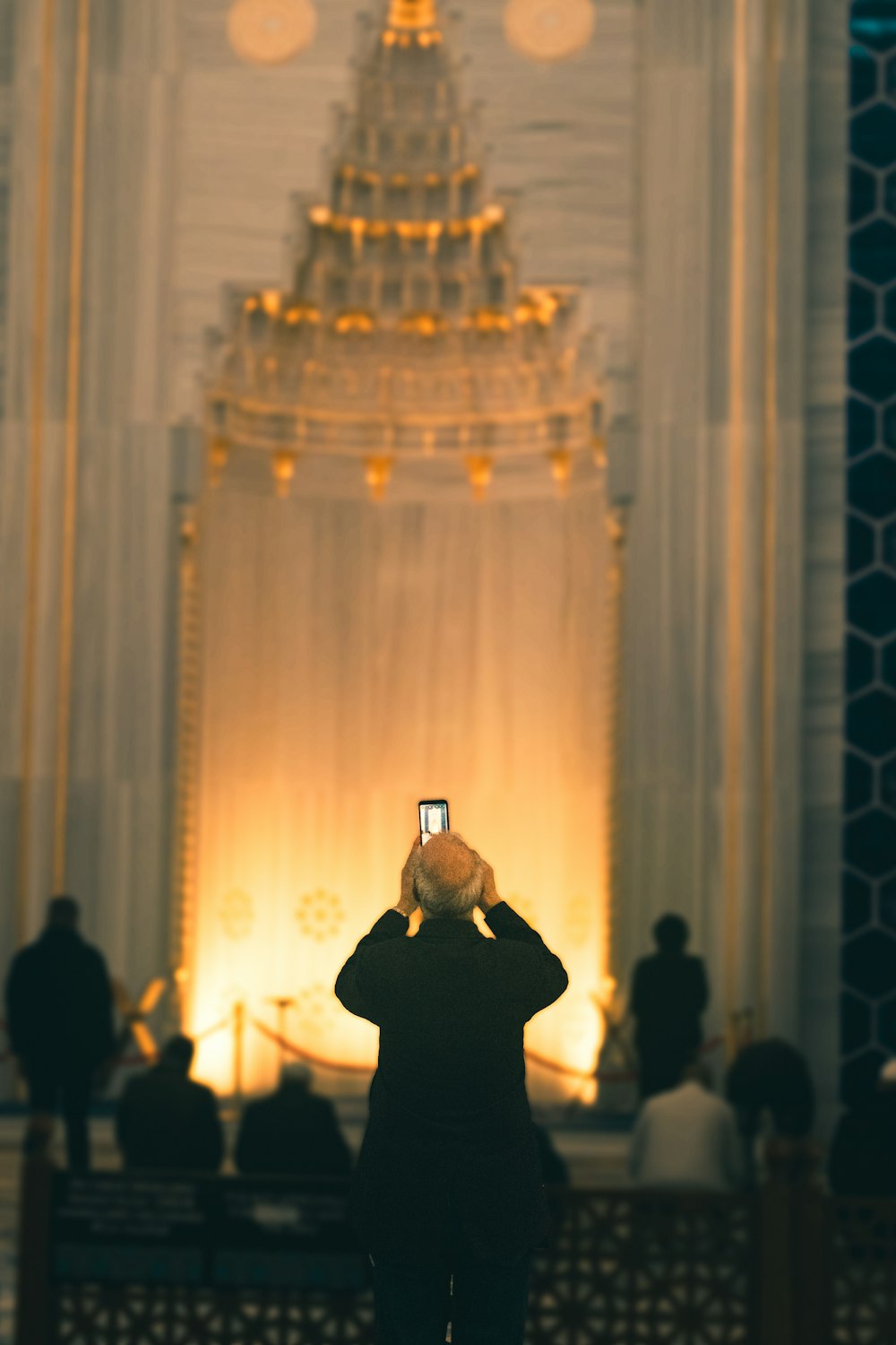 a person taking a picture with a cell phone