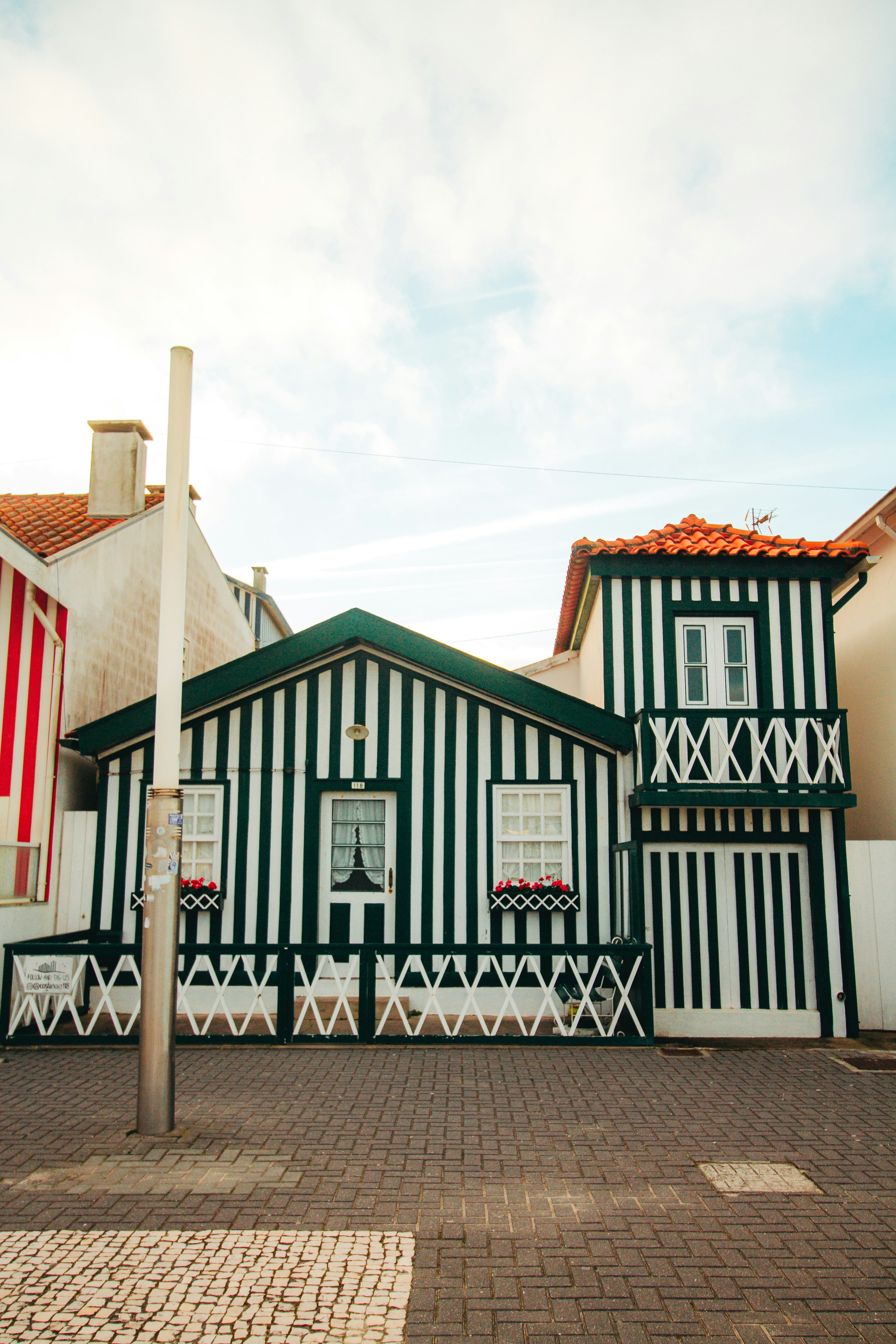 a black and white building with a clock on the front