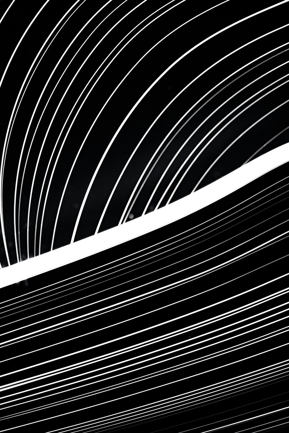 a black and white photo of lines in the sky