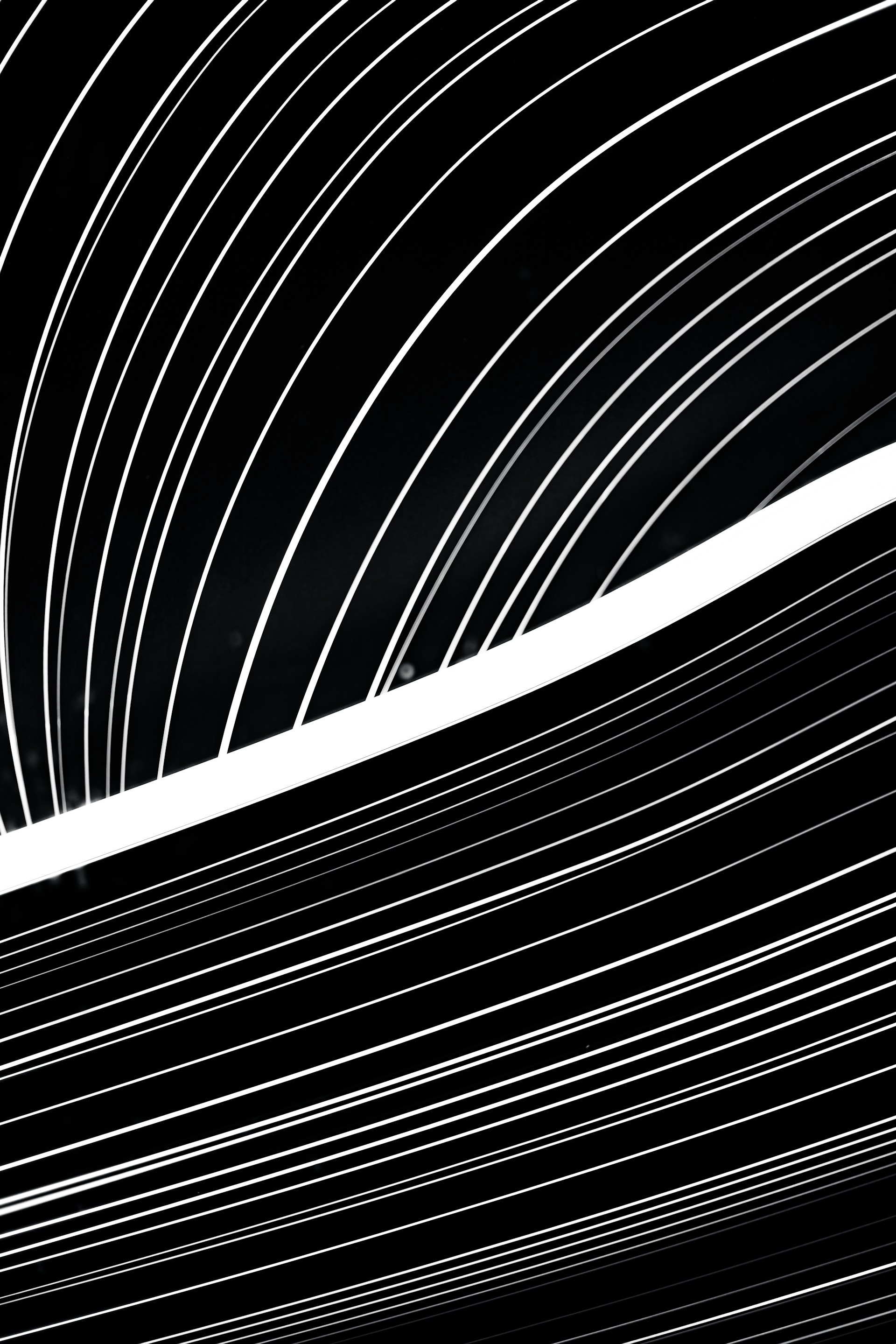 a black and white photo of lines in the sky