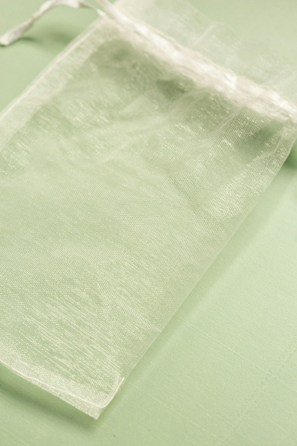 a piece of white organine sitting on top of a table