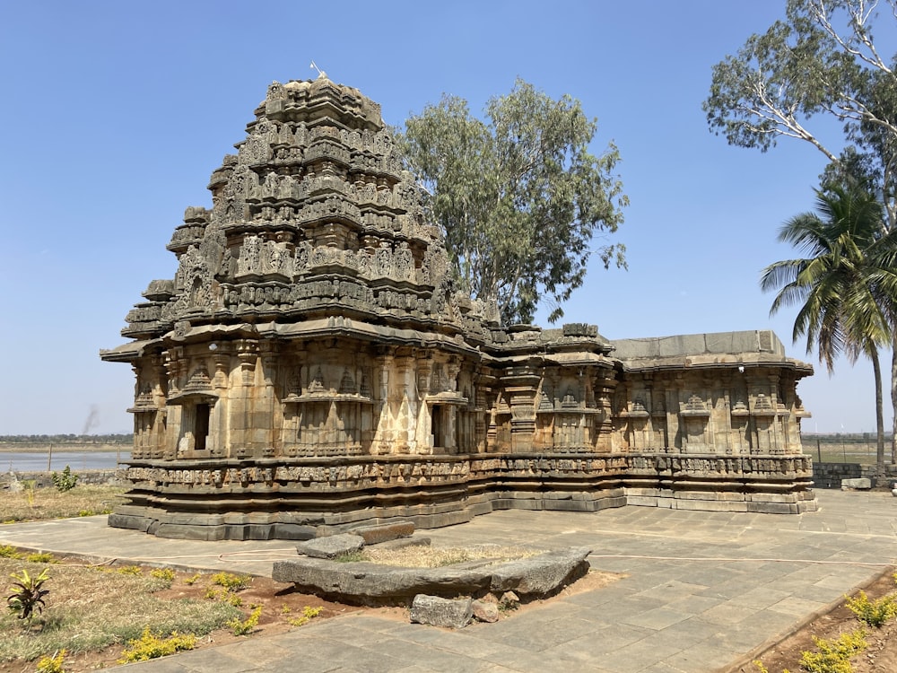 a large stone structure sitting next to a body of water